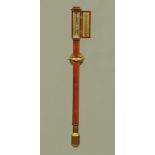 A mahogany cased marine barometer complete with brass gimbal,