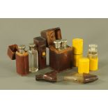 A collection of four vintage leather cased glass flasks and two chemist bottles. Tallest 12 cm.