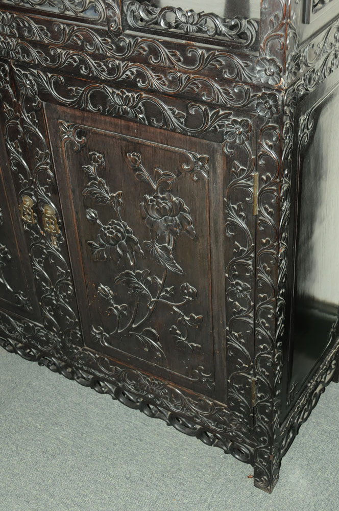 A 19th century Chinese hardwood cabinet in two sections, - Image 9 of 18