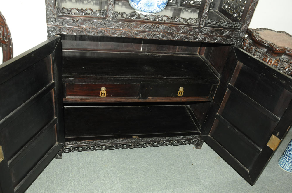 A 19th century Chinese hardwood cabinet in two sections, - Image 11 of 18