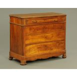 A late 19th century continental walnut chest of one shallow and three graduated drawers flanked by