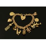 A 9 ct gold charm bracelet, with padlock and ten charms. 45 grams.