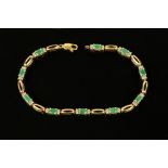 A 9 ct gold emerald and diamond tennis bracelet. Length 19 cm (see illustration).