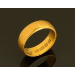 A 22 ct gold wedding band. Size L, weight 5 grams.