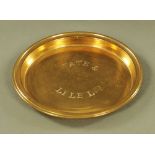 A late 19th century brass shallow dish or ashtray, stamped to centre Tate & Lyle Limited, 1 cm high,