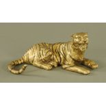 A metal model of a recumbent Tiger. Length 36 cm.