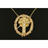 A 9 ct gold chain with 9 ct gold seed pearl set cross pendant, 9.9 grams.