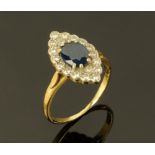An 18 ct gold Marquise sapphire and diamond ring. Size P/Q, hallmarked rubbed but read as 18 ct.