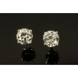 A pair of 18 ct white gold diamond set ear studs, diamond weight +/- .82 carats.