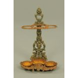 A Victorian cast iron hall stick stand, with detachable drip tray. Height 65 cm, width 41 cm.