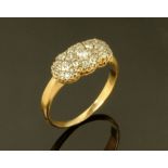 A gold coloured metal diamond set cluster ring, 3.1 grams. Size Q.