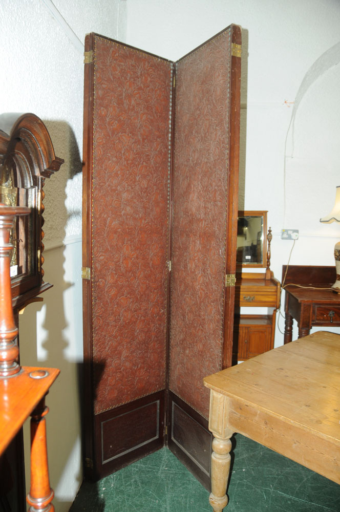 A massive mahogany four fold screen, with gilt embossed cloth panels. - Image 8 of 10