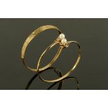 Two 9 ct gold bangles, one with pearl terminals, 10.8 grams gross.