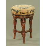 A Victorian mahogany revolving circular music seat. Diameter 35 cm.