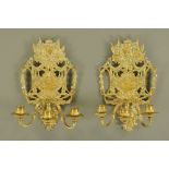 A pair of 19th century brass three branch candle sconces, probably French,