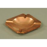 A heavy copper octagonal ashtray, impressed mark to base FD3551, 16.5 cm square.