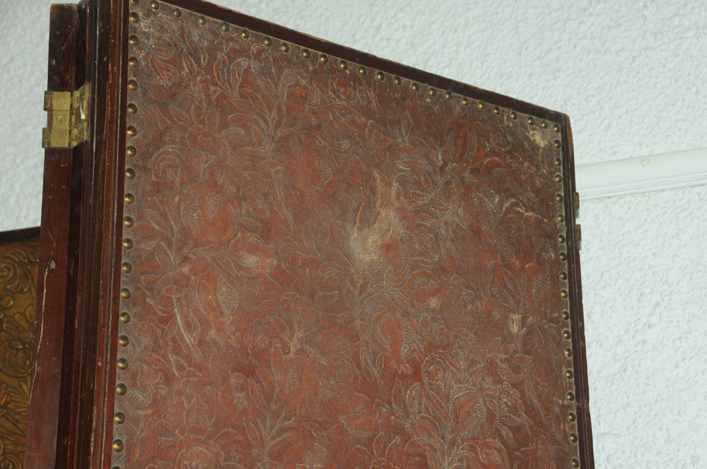 A massive mahogany four fold screen, with gilt embossed cloth panels. - Image 10 of 10