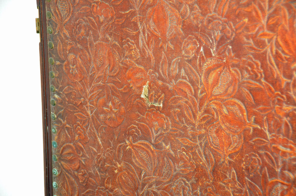 A massive mahogany four fold screen, with gilt embossed cloth panels. - Image 5 of 10