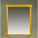 A large late 19th century gilt wood overmantle mirror, with moulded cornice and leaf,