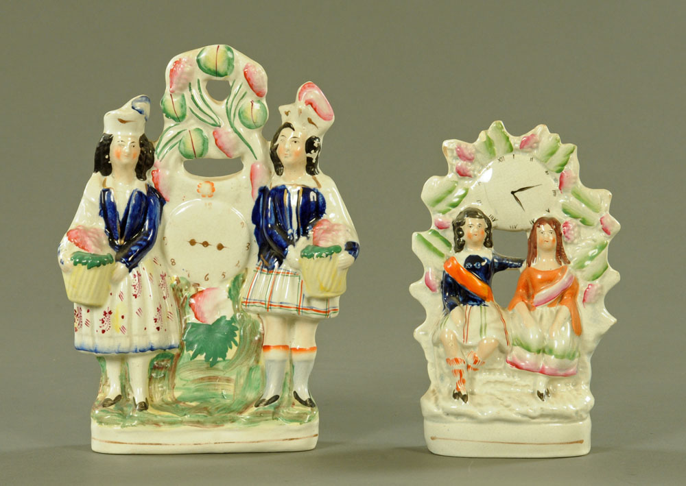 Two 19th century Staffordshire "Clock" figure groups. Tallest 26 cm.