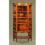An Edwardian pen work bow fronted display cabinet,