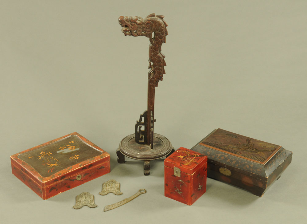 Three pieces of antique bronze money, a Chinese dragon lamp, lacquered tea caddy and two boxes.