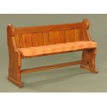 A late Victorian pitch pine pew, 145 cm wide.