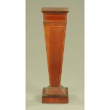 An Edwardian inlaid mahogany pedestal, of inverted square tapering form raised on a stepped base.