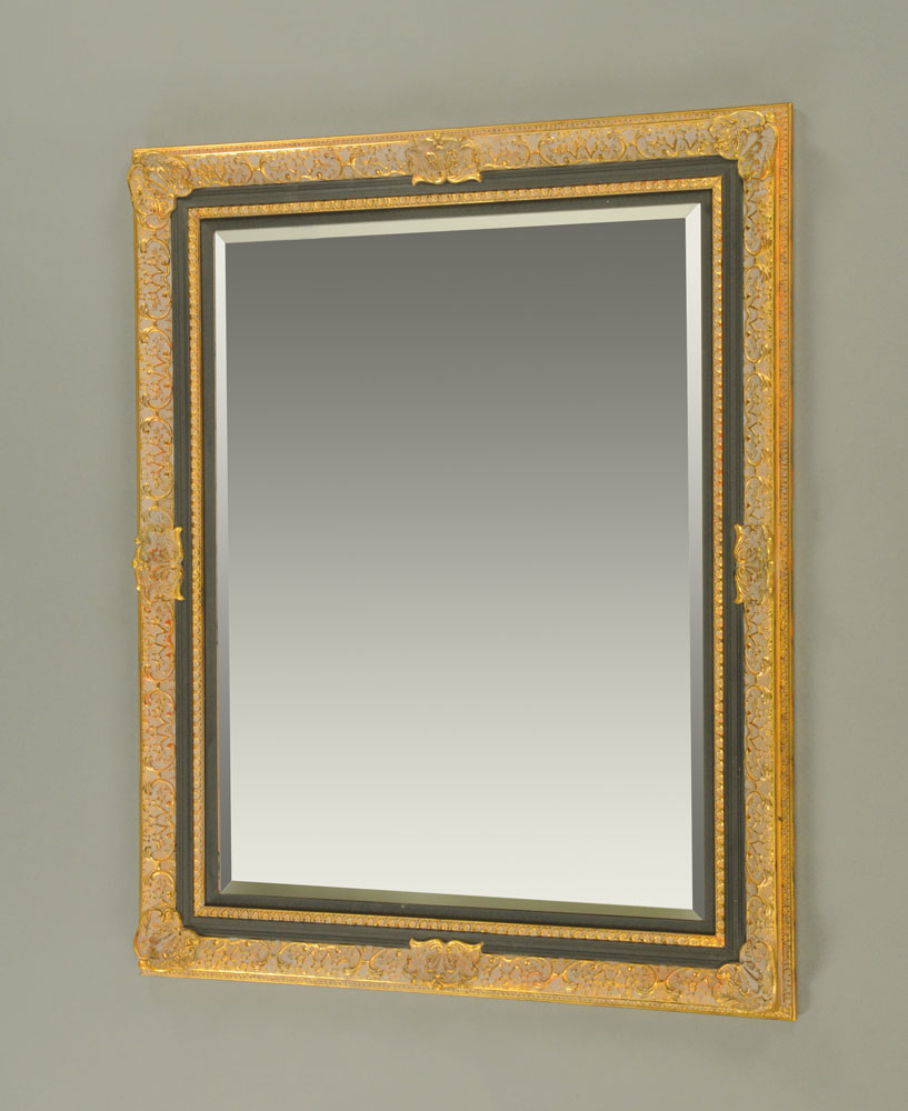 A gilt and painted rectangular mirror, with bevelled glass. 102 cm x 126 cm.