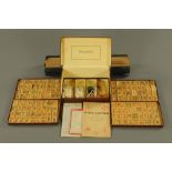 A Hamley Brothers Ltd London mahjong set, in leatherette case and complete with stands.
