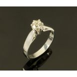 A platinum solitaire ring, set with a diamond weighing +/- .50 carats. Size M/N.