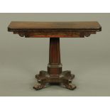 An early 19th century rosewood turnover top tea table, with rounded corners, faceted centre column,