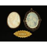 Three 9 ct gold mounted brooches, one cameo,