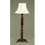 A mahogany bed post lamp standard,