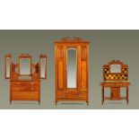A Victorian walnut bedroom suite, comprising wardrobe, dressing table and washstand.