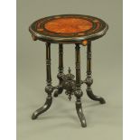 A James Shoolbred & Co London ebony and amboyna inlaid circular table,