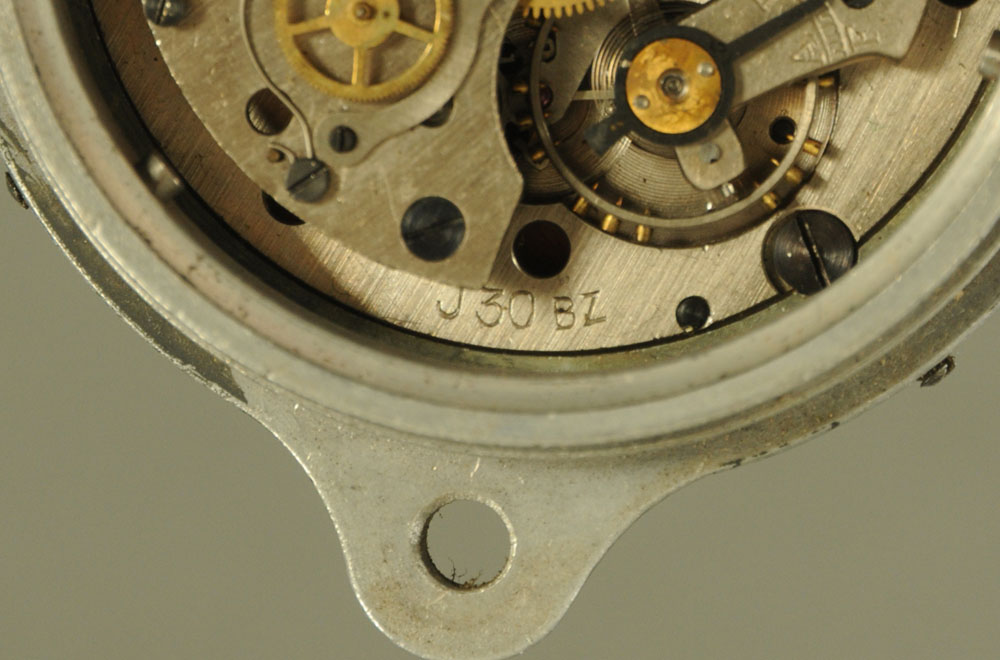 A Second world War Messerschmitt cockpit clock, in aluminium case. Width 6 cm. Serial No. - Image 4 of 4
