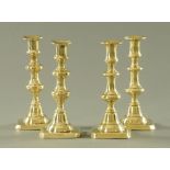 Two pairs of 19th century brass candlesticks. Height 20.5 cm.