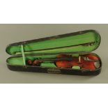 A 19th century violin, size of back 14 1/4", together with wooden case and bow.
