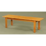 A late Victorian oak rectangular bench, the top with moulded edge on plain legs.