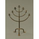 A wrought iron seven sconce candlestick, 52.5 cm high.