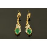 A pair of 9 ct gold emerald drop earrings.
