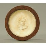An early 20th century plaster roundel, thought to depict sir Noel Paton (1821-1901),