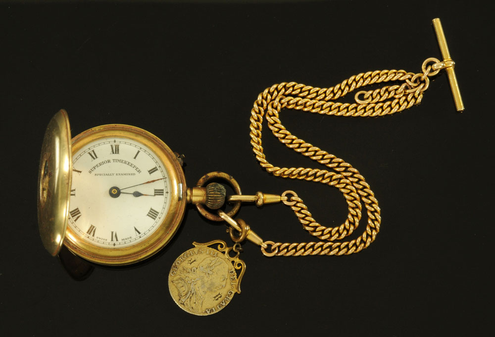 A vintage plated "Superior Time Keeper" half Hunter pocket watch with double Albert chain with 1787