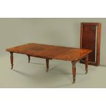 A Regency mahogany extending dining table, with pullout action and three full leaves,