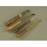 Four 19th century wooden handled burnishing tools. Longest 23 cm.