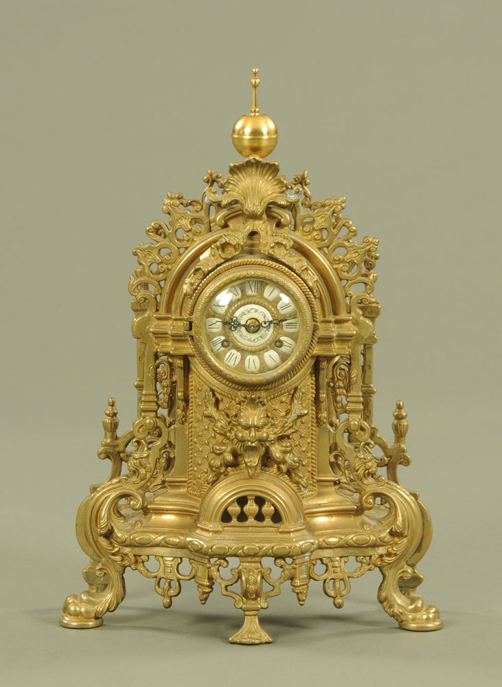 A continental brass mantle clock, with two train movement striking on a bell.