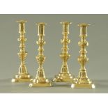 Two pairs of 19th century brass candlesticks. Height 23 cm.