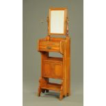 A late Victorian walnut dressing stand, with mirror, drawer,