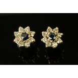 A pair of sapphire and diamond ear studs.